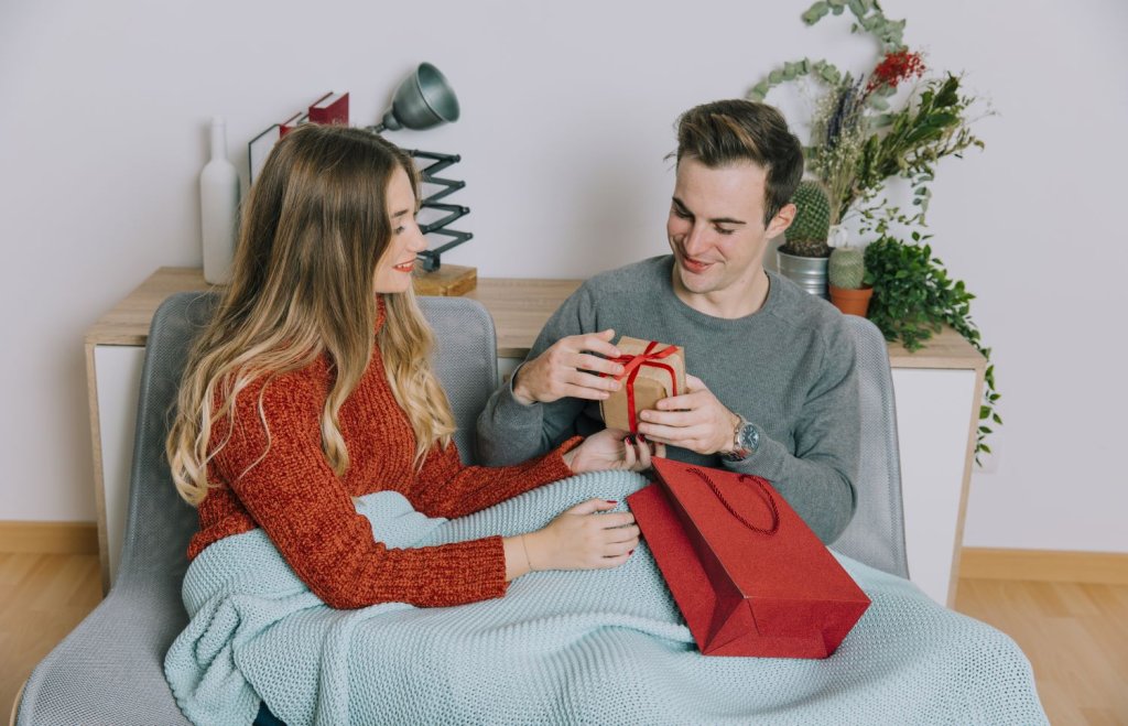 man-looking-present-from-woman.jpg man-looking-present-from-woman.jpg