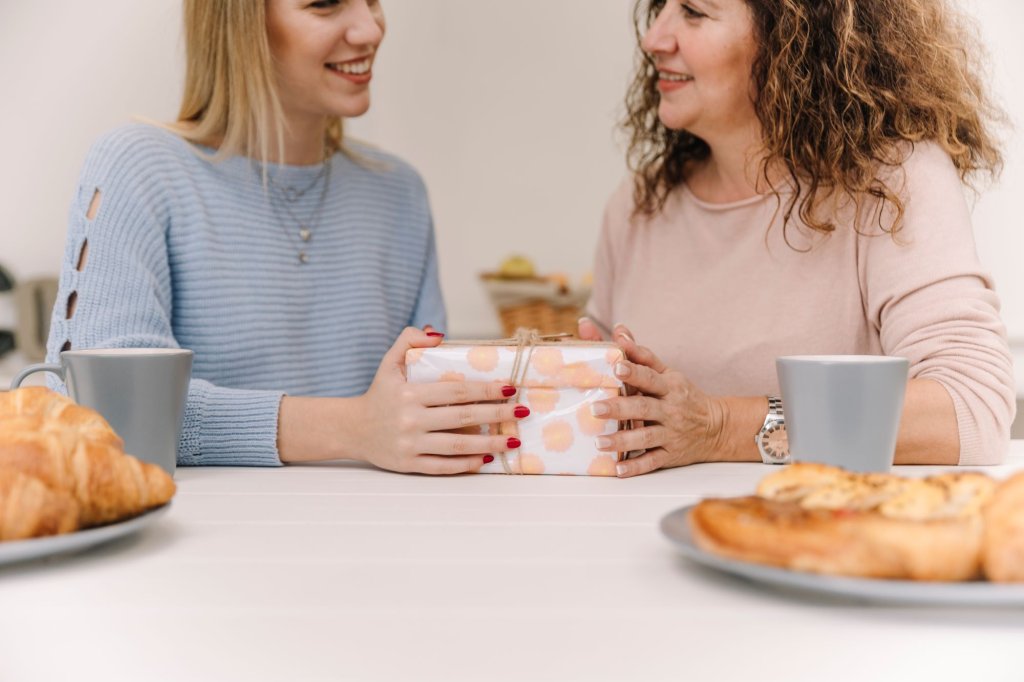 smiling-woman-giving-gift-mom-breakfast.jpg smiling-woman-giving-gift-mom-breakfast.jpg